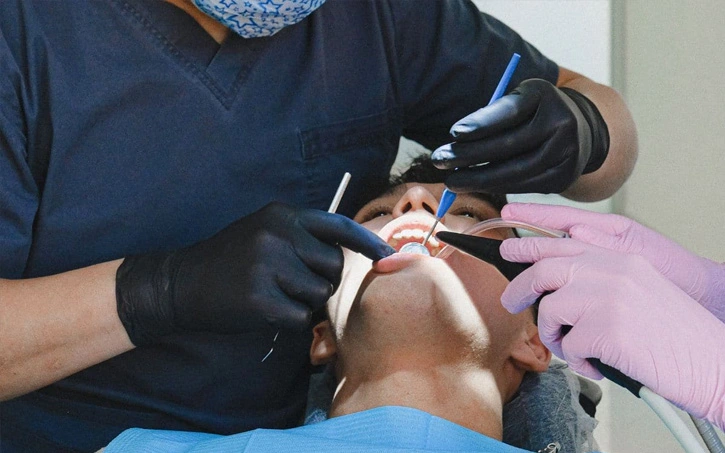 Brooklyn implant dentist reviewing a CT scan before a dental implant consultation