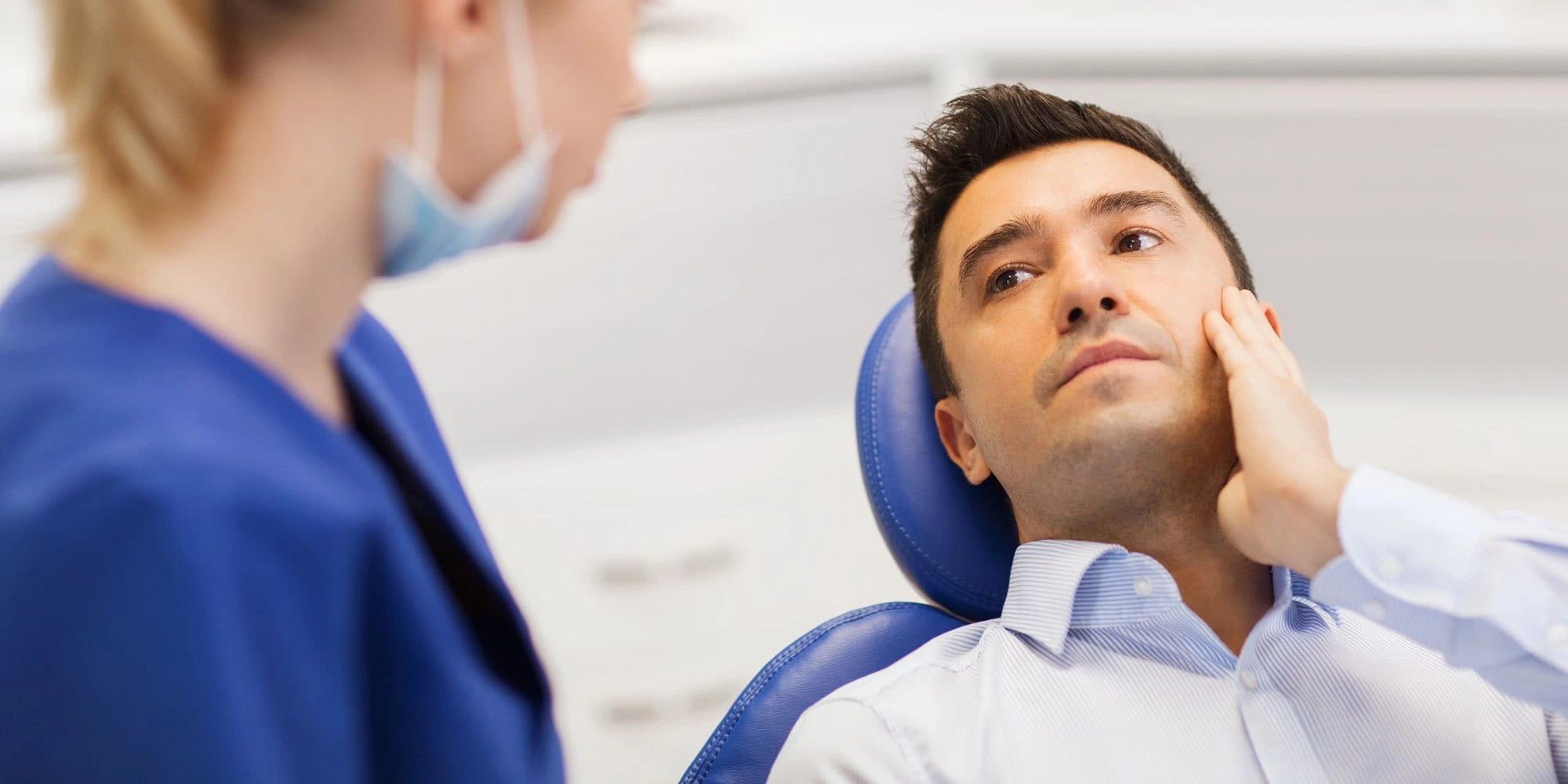 Russian and Ukrainian speaking dentist in Brooklyn explaining treatment plan to patient